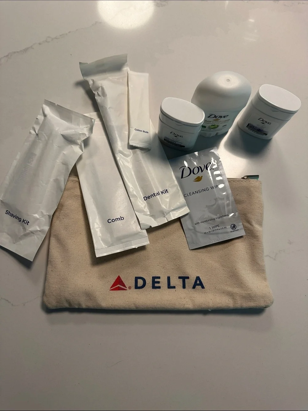 NWOT- Delta Travel Amenity Pouch with Toiletries in Beige and Red/Blue Logo